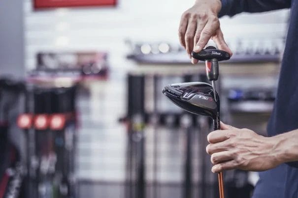 Man preparing golf club